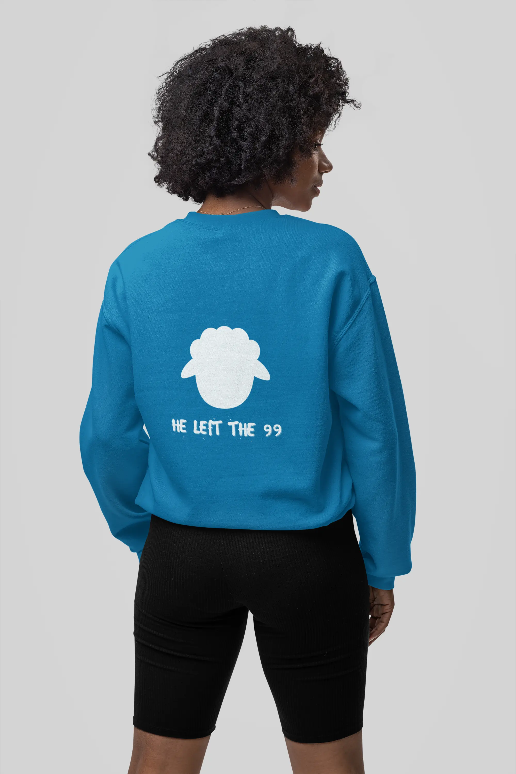 Back view person wearing He Left 99 sweatshirt, sapphire color, unisex fit, faith sweatshirt, Christianity faith apparel
