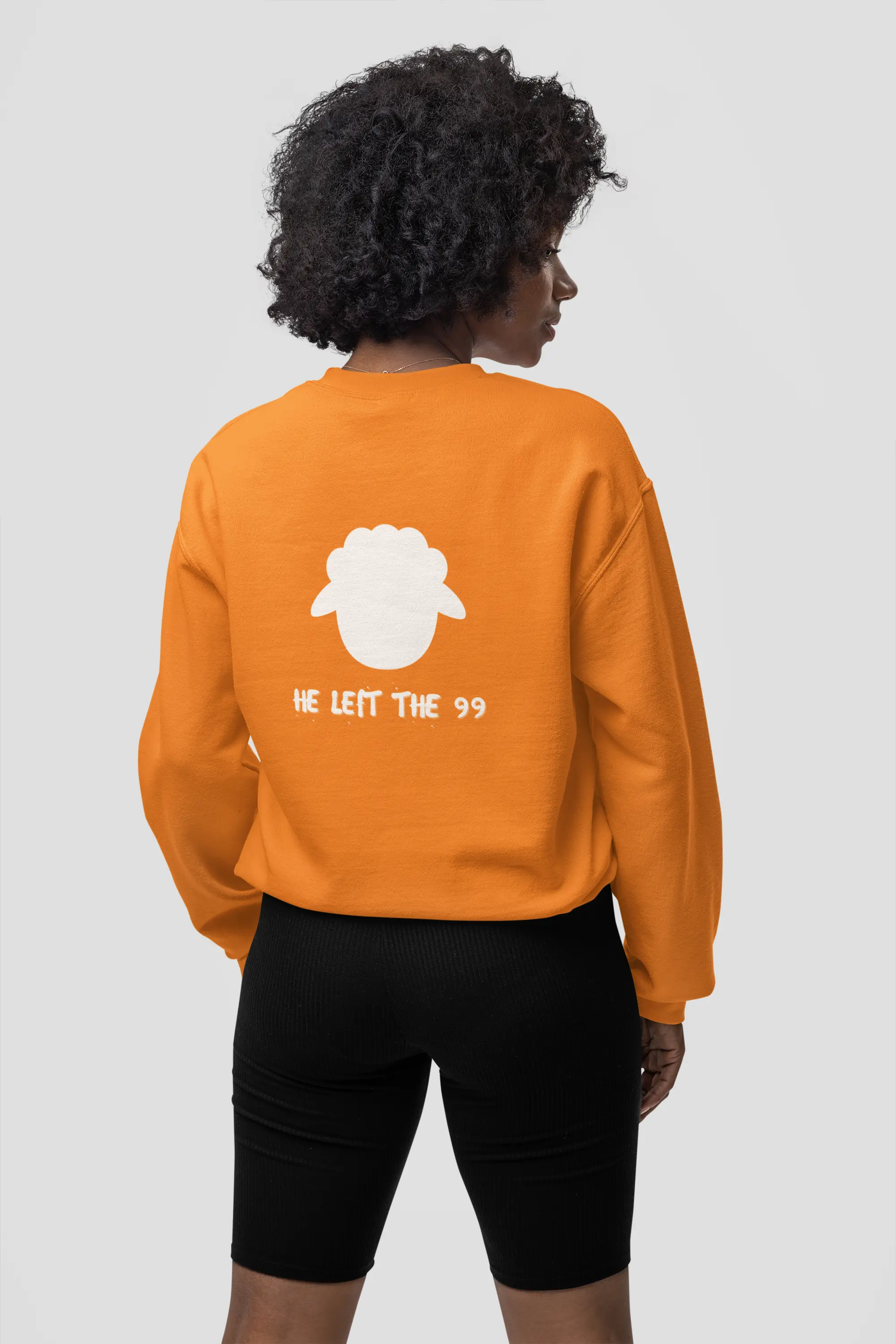 Back view person wearing He Left 99 sweatshirt, orange color, unisex fit, faith sweatshirt, Christianity Jesus gifted sweatshirt
