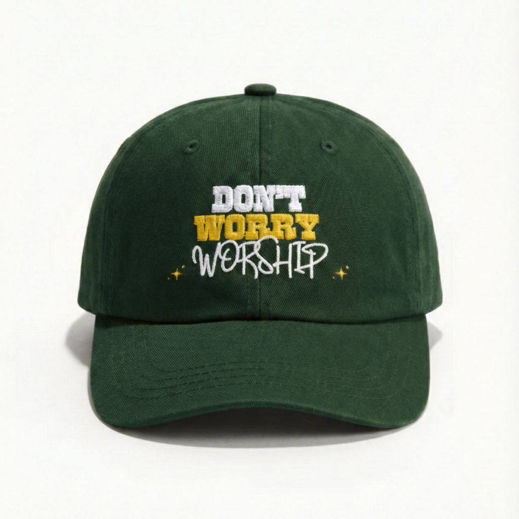 Detailed embroidery on a green Christian hat with 'Don't Worry Worship' text, minimalist faith-based headwear