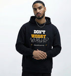Man wearing a Christian black hoodie with dont worry worship text