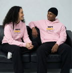 2 people sitting on couch wearing Christian streetwear hoodie in pink featuring the Don't Worry Worship minimalist design for a modern faith-based look